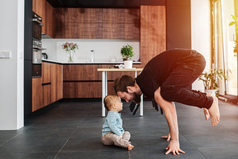 Optimal Fertility - Healthy Father Doing Yoga with Infant Son at Home