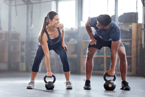 Healthy Couple with Optimal Free Testosterone Levels Working Out with Kettlebells - Saliva Hormone Test