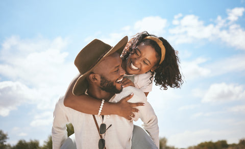 Happy Fertile Couple with Optimal Saliva Progesterone Levels Smiling and in Love Under a Beautiful Blue Summer Sky