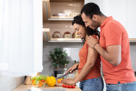 Healthy Young Couple with Optimal Salivary Testosterone Levels Cooking Together