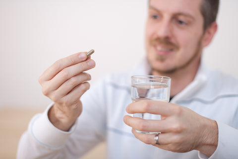 Married Man Taking an Herbal Supplement for Male Infertility