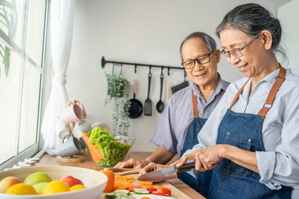 Loving Senior Elderly couple Wear Apron and Cooking in Kitchen - InterPlexus Blog