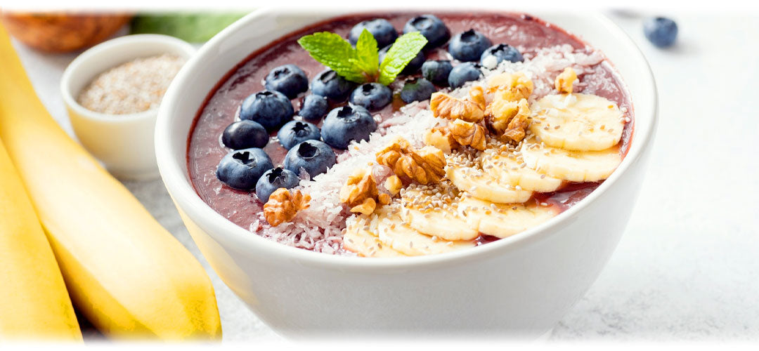 An appetising smoothie protein bowl filled with coluorful ingredients such as blueberries, coconut and nuts, showcasing a nutritious and balanced meal option