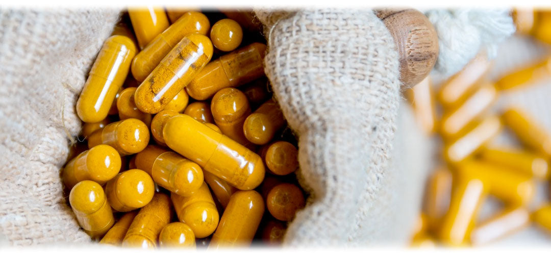 An image  featuring a variety of vitamin and mineral supplements in pill and capsule form. The image suggests the topic of dietary supplements and nutritional support