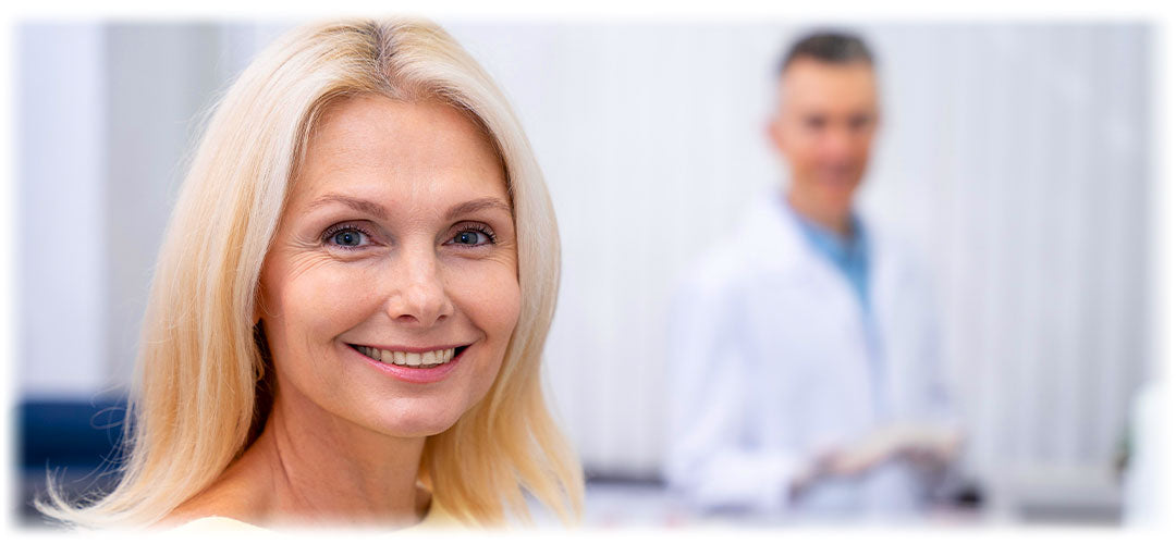 Confident woman smiling in a clinic, trusting in Lily & Loaf's commitment to health and wellness.