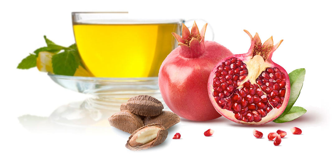 Green tea and pomegranate with almonds, highlighting natural antioxidants.