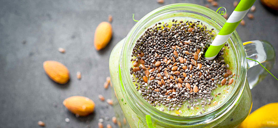 An image of a delicious green smoothie topped with chia seeds