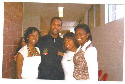 Bliss with the AJ of BET's 106 & Park show after singing before his keynote speech at East Orange Campus High School