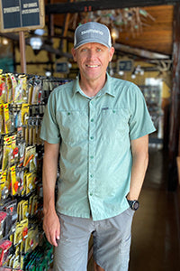 Tackle store manager, Tim