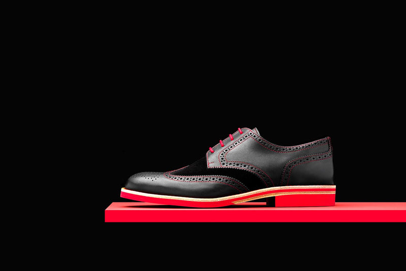 black and red wingtip shoes