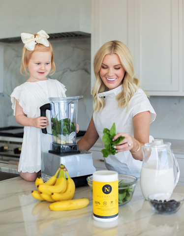 Dr. Brooke Stubbs and daughter making a smoothie with NutraStat fiber supplement