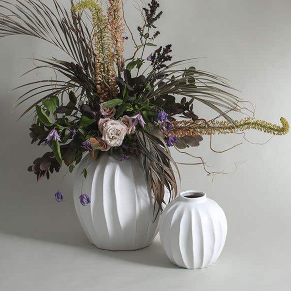 Beautiful flowers staged in grooved ceramic vase