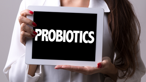 woman holding probiotic sign