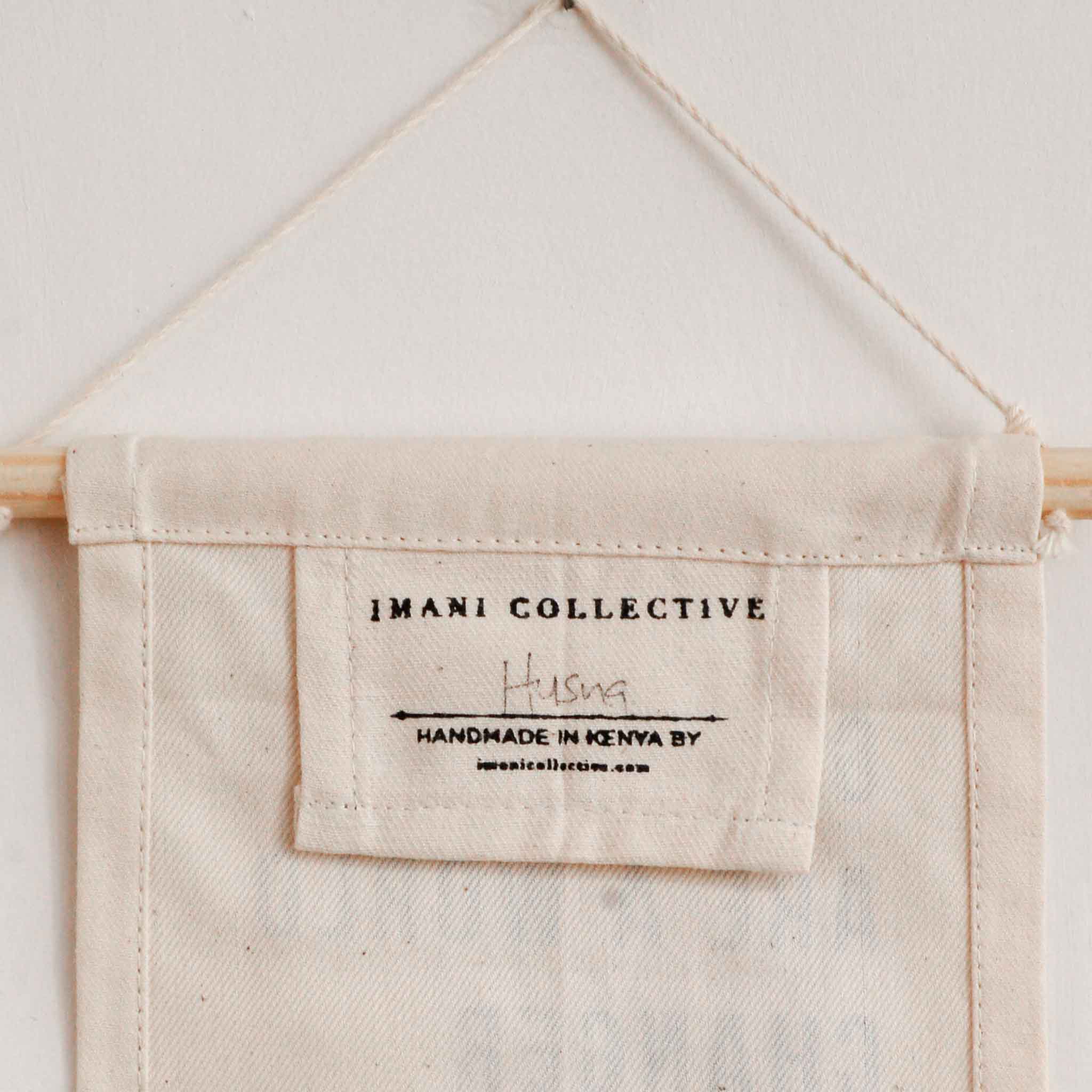 Imani Collective Be Kind Hang Sign