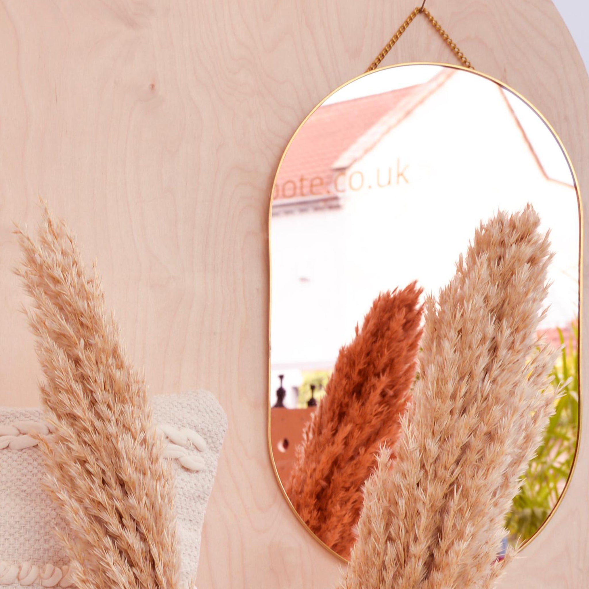 Oval Rose Gold Mirror with Brass Chain and Edging