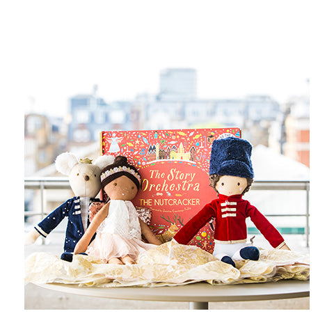 Children's ballet dolls set against a backdrop of the London skyline.