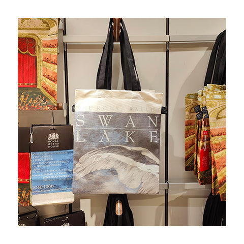 A tote bag featuring a classic-style poster for the ballet 'Swan Lake'