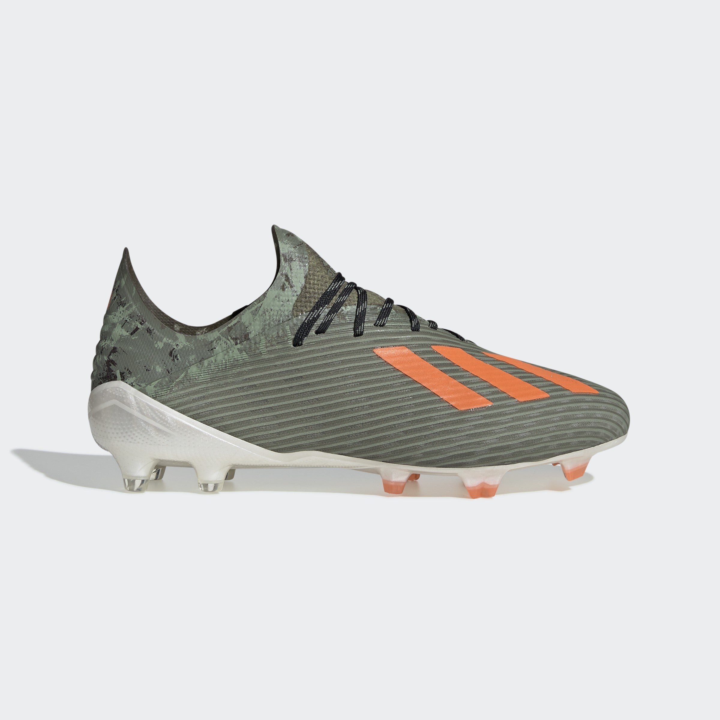 orange and green soccer cleats