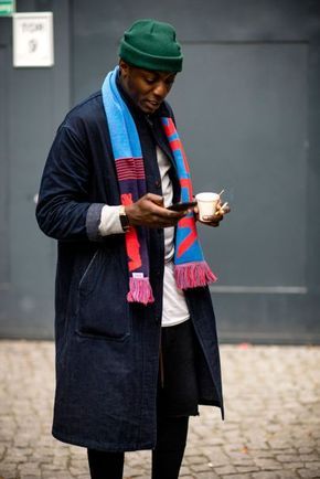 Street style shot from Berlin Fashion Week wearing a scarf to add a splash of colour.