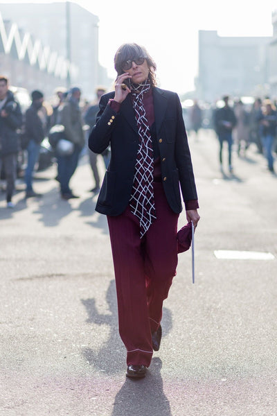 Street style shot from Milan Fashion Week wearing a cool geometric scarf.