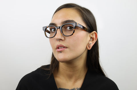 Woman wearing these luxury designer SEE Eyeglasses