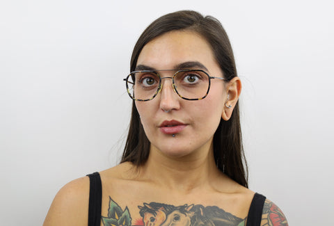 Woman wearing these luxury designer SEE Eyeglasses