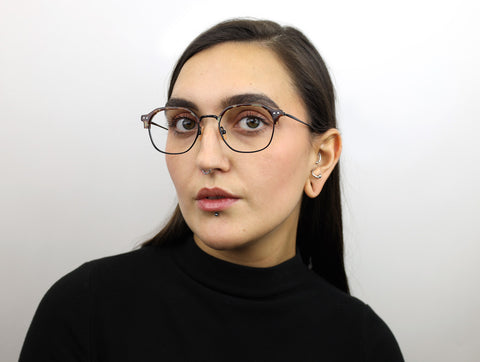 Woman wearing these luxury designer SEE Eyeglasses