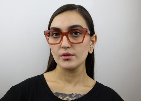 Woman wearing these luxury designer SEE Eyeglasses