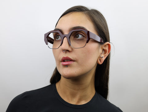 Woman wearing these luxury designer SEE Eyeglasses