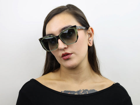 Woman wearing these SEE Sunglasses