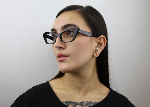 Woman wearing these luxury designer SEE Eyeglasses