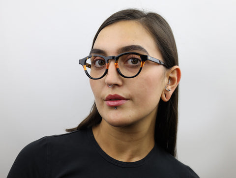 Woman wearing these luxury designer SEE Eyeglasses