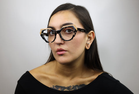 Woman wearing these luxury designer SEE Eyeglasses