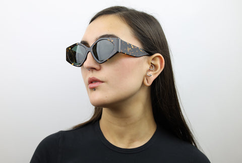 Woman wearing these luxury designer SEE Sunglasses. Black Glasses