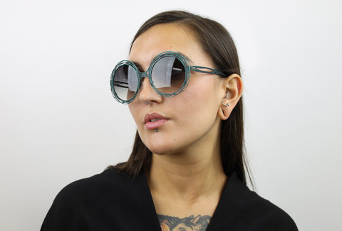 Woman wearing these luxury designer SEE sunglasses