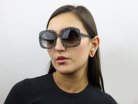 Woman wearing these luxury designer SEE sunglasses