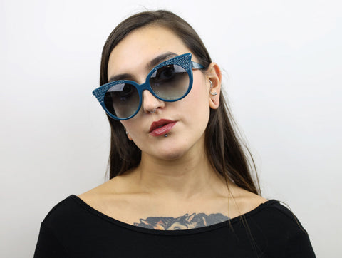 Woman wearing these SEE Sunglasses