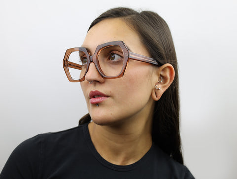 Woman wearing these luxury designer SEE Eyeglasses