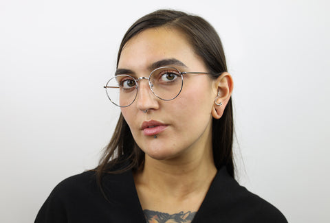 Woman wearing these luxury designer SEE Eyeglasses