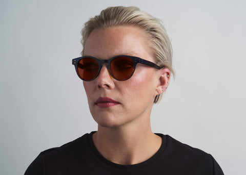 Woman wearing luxury Eyewear from SEE. Designer Sunglasses and Reading Glasses