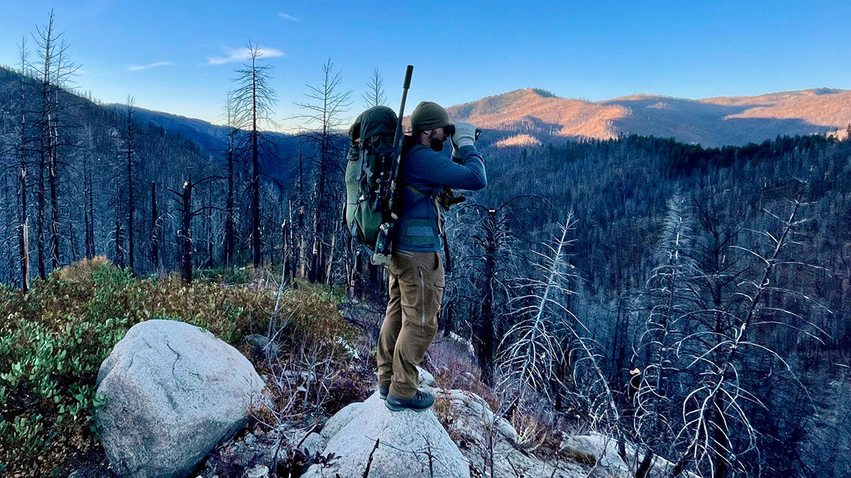 Hunter Packing A Suppressed Rifle