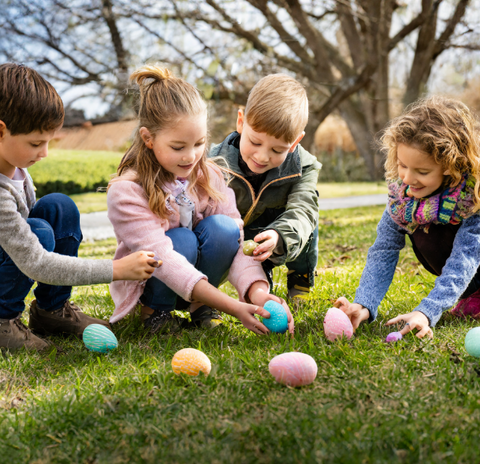 children enjoying an easter egg hunt
