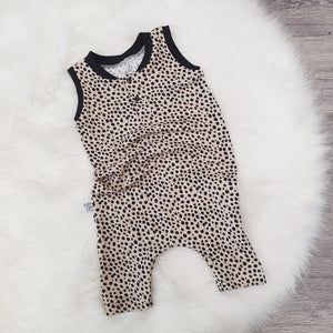 Nude and black spotty romper for children and babies
