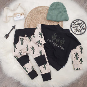 Funky baby and toddler outfit featuring 'can't touch this' slogan and cactus print