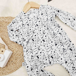 alternative babygro in white with black paint splatter effect print