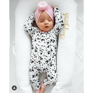 Baby girl monochrome romper with baby pink accents. Handmade in the the UK