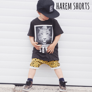 Toddler boy wearing bayridgecaskandkeg harem shorts in mustard spot