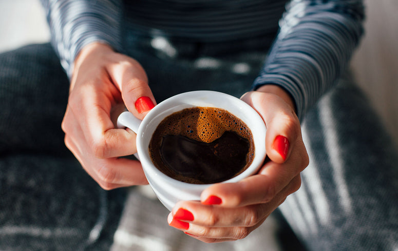 Holding Coffee