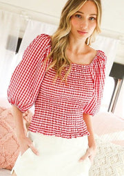 red and white smocked top with square neckline