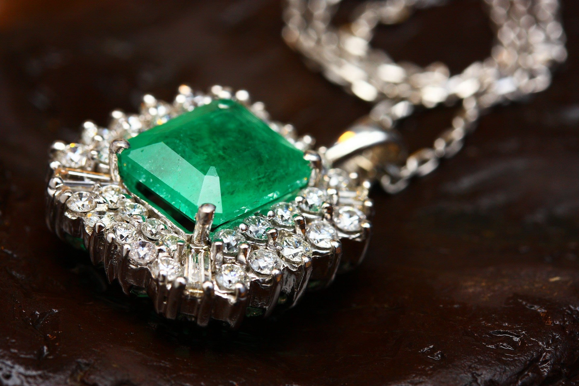 A piece of emerald in a silver amulet